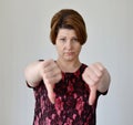 Angry young woman showing thumb down Royalty Free Stock Photo