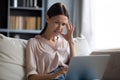 Confused woman frustrated with computer malfunction problems Royalty Free Stock Photo