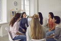 Angry woman sharing her shocking story in therapy session or support group meeting Royalty Free Stock Photo