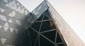 Angular Modern Building Facade with Geometric Patterns and Glass Triangles architecture Royalty Free Stock Photo