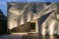 angular modern home front with spotlights on textured walls Royalty Free Stock Photo
