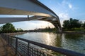 Angular view of bridge over canal, at sunset, in a park in Madrid, Spain