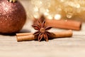 Anice cinnamon and bauble christmas decoration in gold Royalty Free Stock Photo
