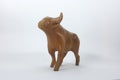 Carved wooden bull and white backdrop