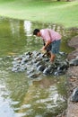 Animal caretaker at Bang Pa In Palace Ayutthaya Thailand 15/01/18 Time 11:40 There are large ponds and large turtles. The