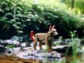 Animal characters built using plastic blocks and placed in nature.