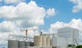 Animal feed factory construction site. Agricultural silo at feed mill factory. Tank for store grain in feed manufacturing. Seed Royalty Free Stock Photo