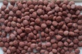 Animal feed mixed from finely ground protein powders of both plants and animals is pelleted to be used as pet food because pellets Royalty Free Stock Photo