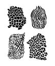 Animal patterns. Leopard, lizard, zebra, giraffe are made in black ink, isolated on white background. The object of Royalty Free Stock Photo