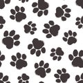 Animal paw vector seamless pattern, cartoon black silhouette paws cat or dog. Simple footprint. Abstract illustration Royalty Free Stock Photo