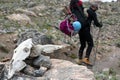 Animal Skull and Hiker with Backpack walking on Trail on Background