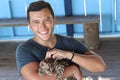 Animal tamer holding a gorgeous ocelot