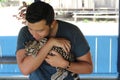 Animal tamer holding a gorgeous ocelot