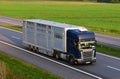 Animal transporter truck driving on a highway. Semi-trailer truck SCANIA with animals in trailer on motorway. MOSCOW REGION - SEPT Royalty Free Stock Photo