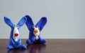 Animals blue rabbits from multi-colored plasticine, which hardens. Children`s creativity. Funny clay toys