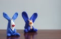 Animals blue rabbits from multi-colored plasticine, which hardens. Children`s creativity. Funny clay toys