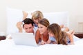 Animated family buying online lying down on bed