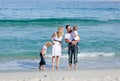 Animated family walking on the sand