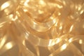 animated glowing ribbons in gold, gently curling and twisting in a seamless loop, creating a soft