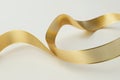 animated ribbon of gold, curling and twisting in an infinite loop, creating a sense of elegant flow