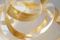 animated ribbon of gold, curling and twisting in an infinite loop, creating a sense of elegant flow