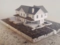 Animated sequence of a house being constructed step by step from foundation to finish illustrating the house developing process