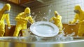 Animating tiny workers in hazmat suits cleaning kitchen plate Royalty Free Stock Photo