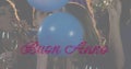 Animation of buon anno text in pink over balloons and crowd of celebrating people partying