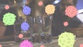 Animation of cartoon macro Covid-19 cells floating over a bartender pouring alkohol into shots