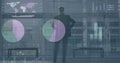 Animation of data processing against rear view of businesman looking out of window at office