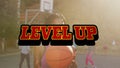 Animation of level up text over woman holding ball