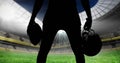 Animation of silhouette of american football player over sports stadium