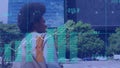 Animation of statistical data processing against african american woman hailing a taxi on the street