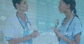 Animation of stock market data processing over diverse female doctor and healthworker discussing