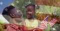 Animation of usa flag over happy african american father and daughter with ua flags