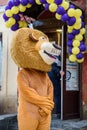 Animator in the costume of Alex the lion from the cartoon Madagascar in the city