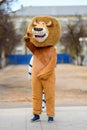 Animator in the costume of Alex the lion from the cartoon Madagascar in the city