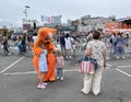 Animator in a tiger costume on the square of Fighters for the power of the Soviets in autumn during the festival of childhood and