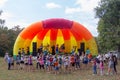 Animators on stage entertain children at the festival day of the village of Kamennomostsky in the autumn park Royalty Free Stock Photo