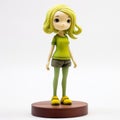 Anime Figure With Green Hair On Wooden Base Royalty Free Stock Photo