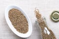 Aniseed, anise seeds, in a white bowl on linen Royalty Free Stock Photo