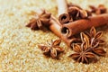 Anise star and cinnamon sticks on brown cane sugar