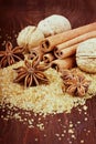 Anise star with cinnamon sticks and walnuts on brown cane sugar Royalty Free Stock Photo