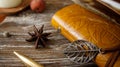 Anise star, leather notebook, pen and apple on wooden table Royalty Free Stock Photo