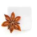 Anise star in a white bowl on white background Royalty Free Stock Photo