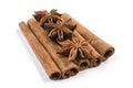 Anise stars laying on cinnamon sticks isolated on white background Royalty Free Stock Photo