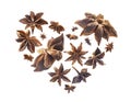 Anise stars in the shape of a heart on a white background