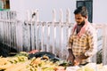 Anjuna, Goa, India. Man Seller Sells Traditional Indian Fried Maize Corn In The Anjuna Market Royalty Free Stock Photo
