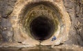 Man sitting inside of Anjuruli tunnel