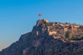Ankara Castle on blue sky background with flying flag Royalty Free Stock Photo